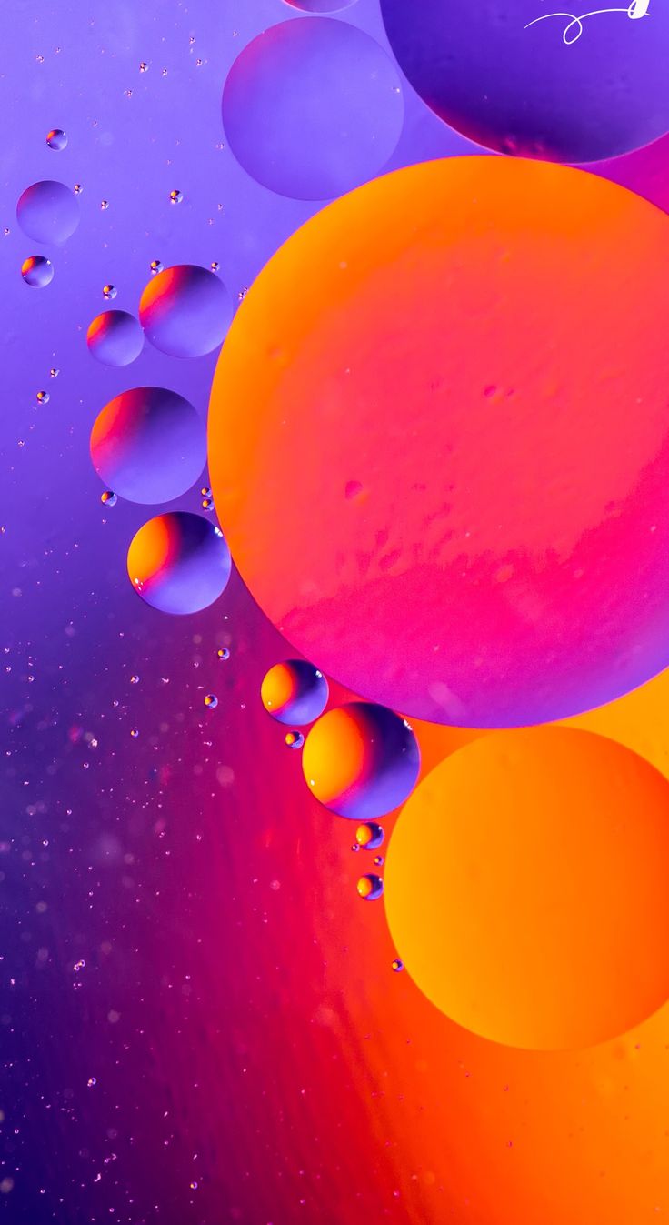 Orange and purple bubbles floating on a violet background.