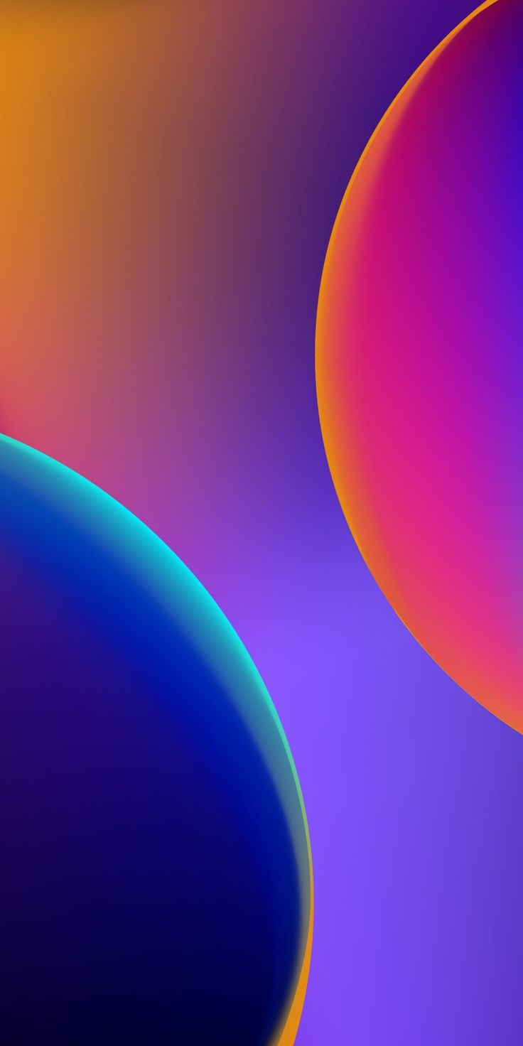 Two glossy planets in orange, pink and blue on a purple background.