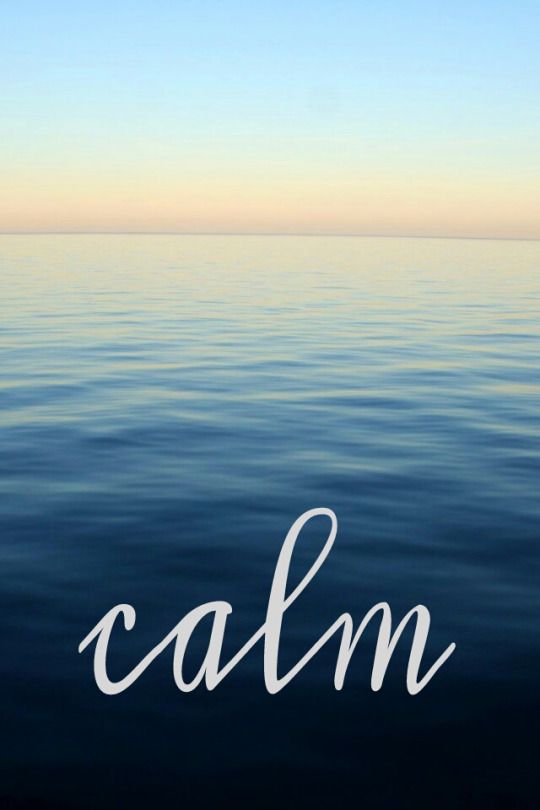 "Calm" in white script over dark still water at dusk.