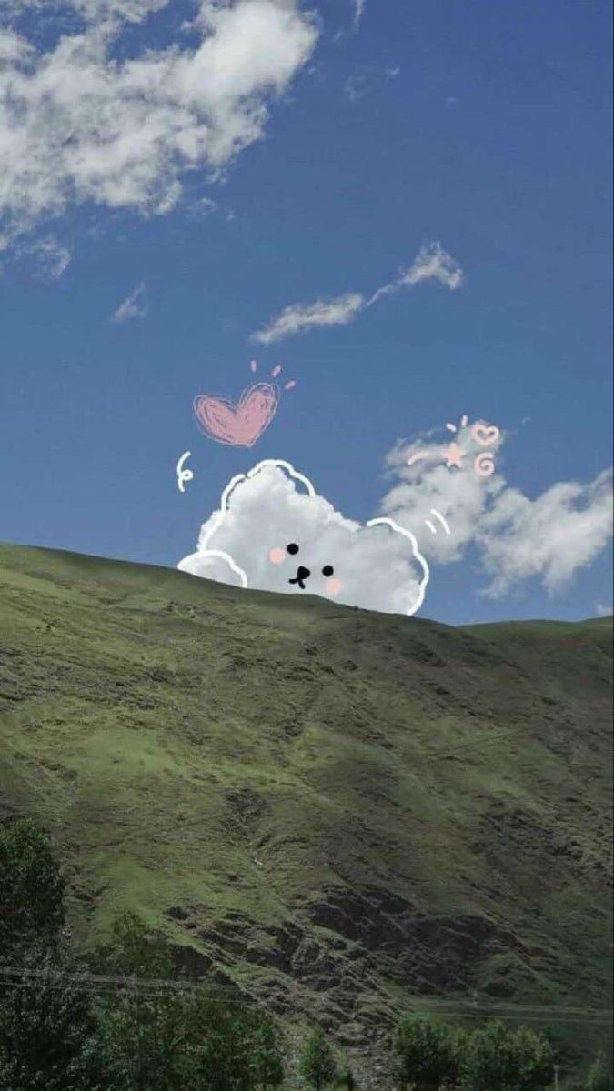 A small white bear peeking over a green hill with a pink heart in a blue sky.