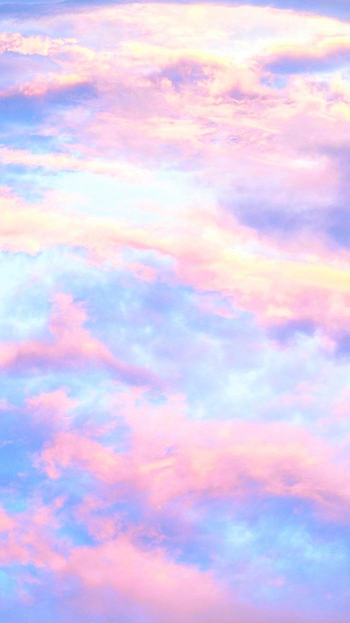 Soft pink, lilac and blue clouds in a dreamy sky.