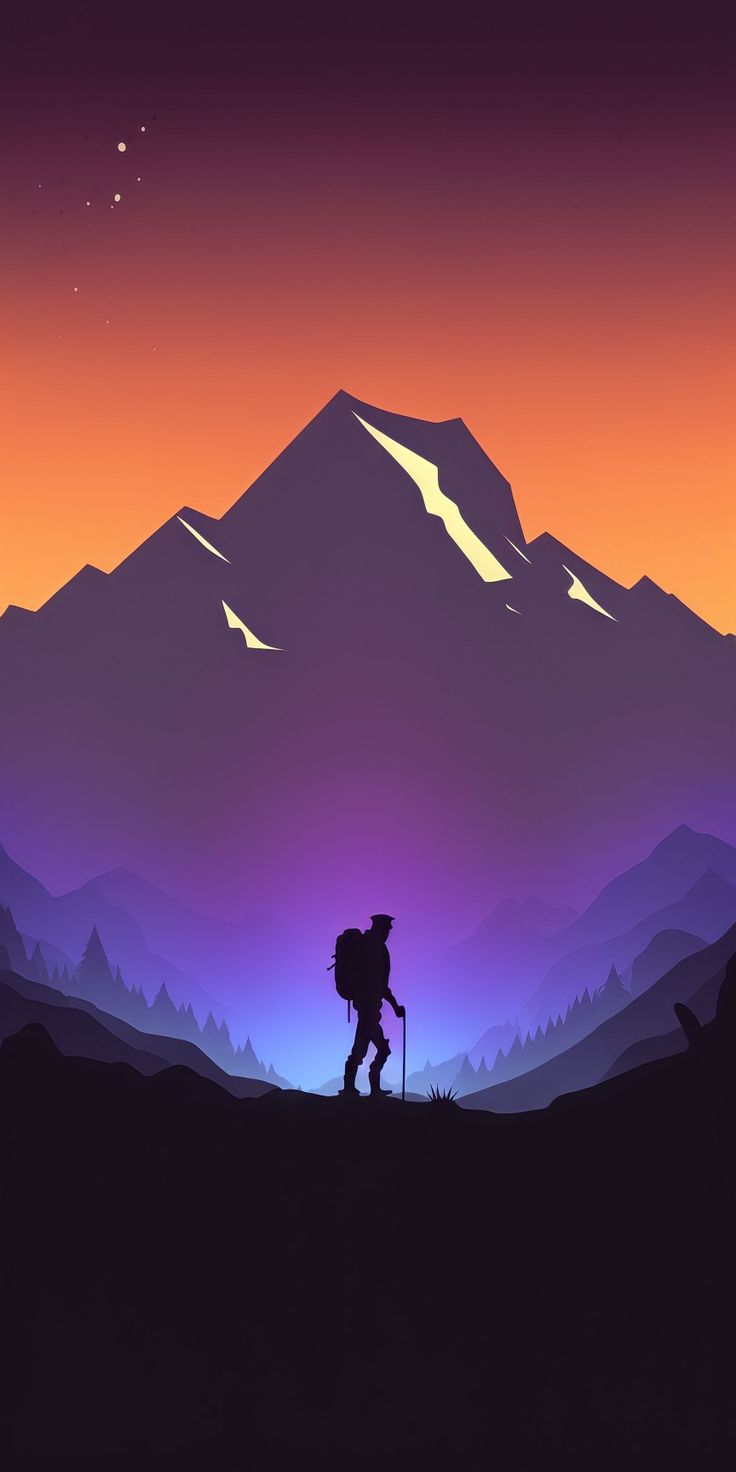 A hiker standing below a mountain peak glowing orange against a purple sky.