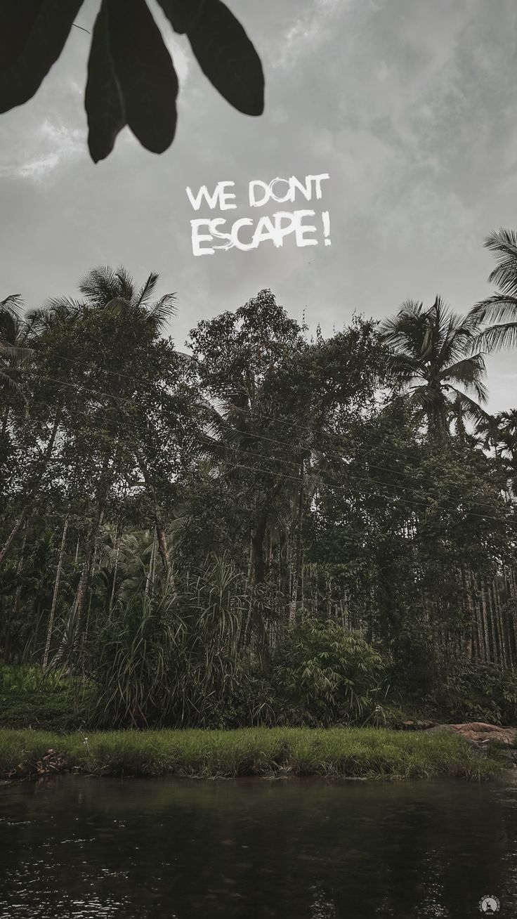 "We don't escape!" in white type over a tropical forest and lake under a grey sky.