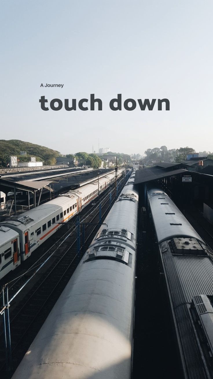 "Touch down" in dark type above an aerial view of parked trains in a rail yard.