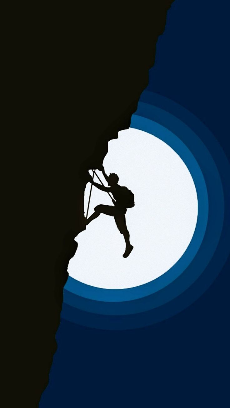 A climber silhouetted on a cliff edge against a huge bright moon.