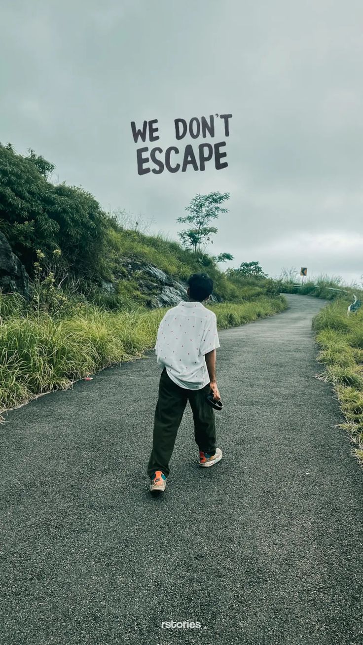 "We don't escape" in black type above a man walking along a green country road.