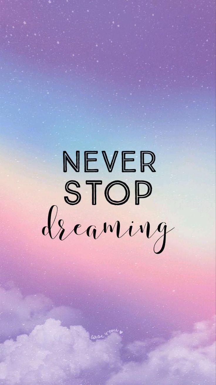 "Never stop dreaming" in dark letters and script above pink clouds on a lilac sky.