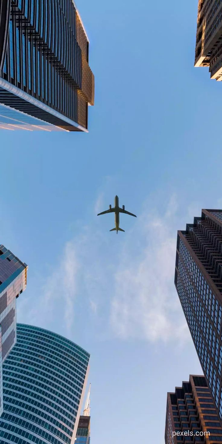 Plane Between Skyscrapers